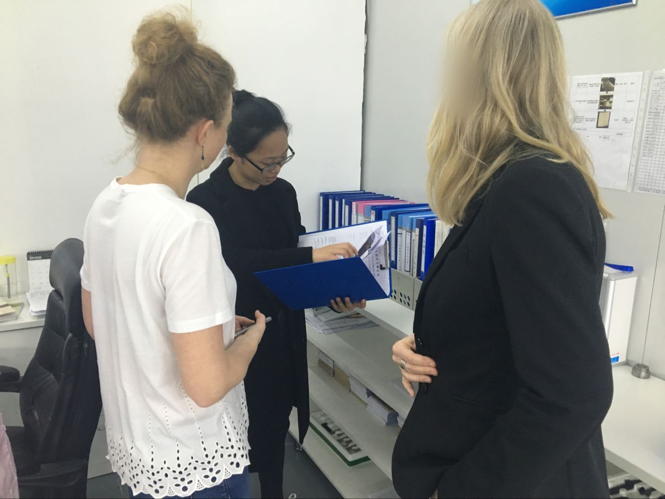 Brand team reviewing project documents with the HTIMES project lead